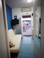 Apartment (One Bedroom Apartment with Balcony) | Living room | TV