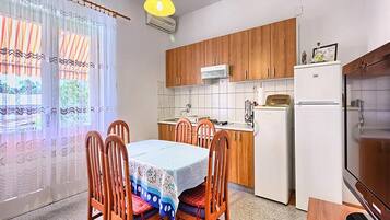 Apartment (Three Bedroom Apartment with Balcony) | Private kitchen | Fridge
