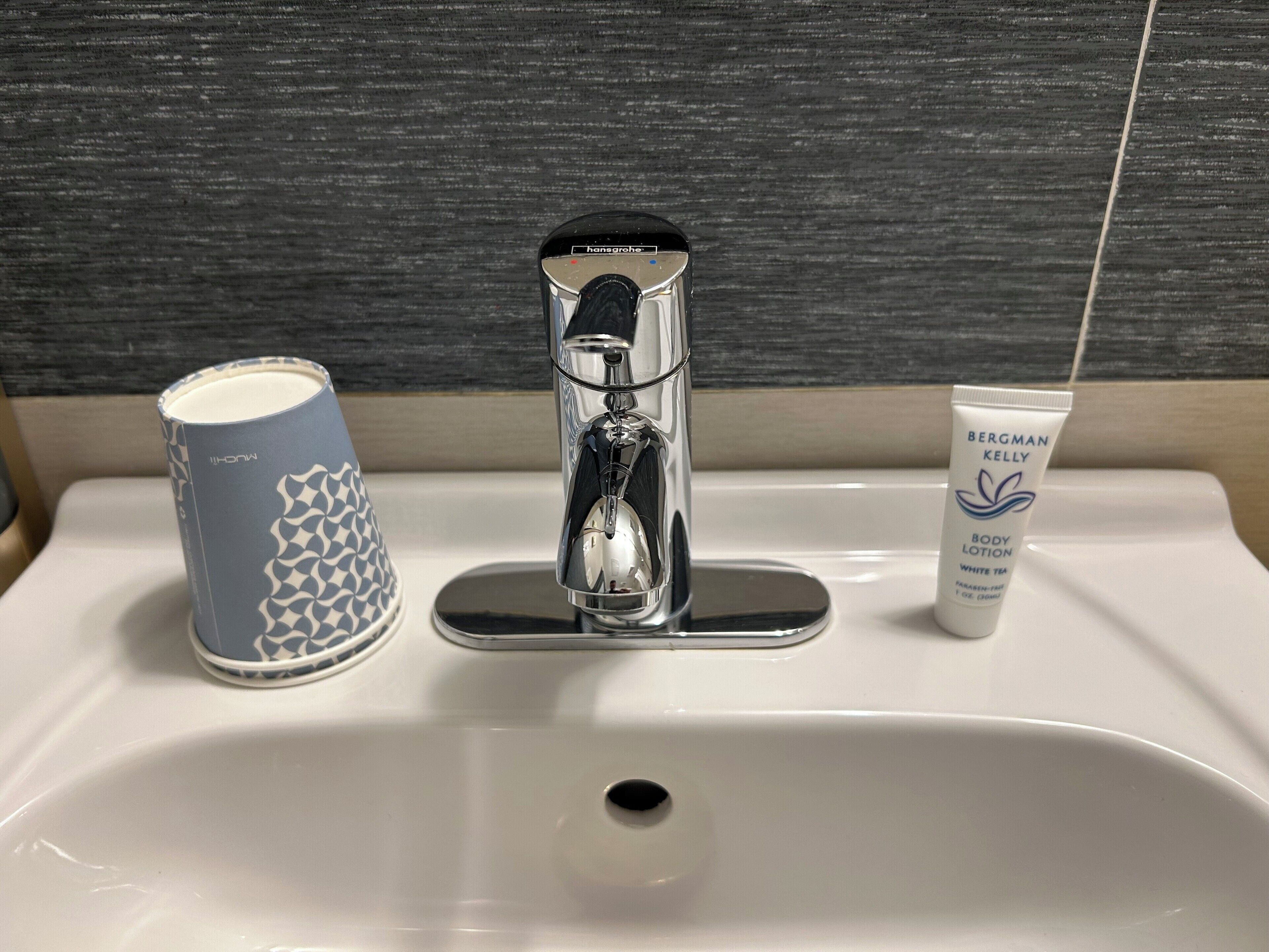 standard interior queen bed room | bathroom | combined shower/bathtub, rainfall showerhead, free toiletries