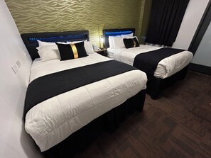 Habitació Deluxe | Roba de llit hipoal·lerg�ògena, cobrellits i caixa forta a l'habitació 