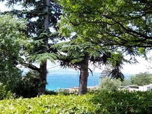 Surrounded by lush greenery and a stunning sea view, this serene setting invites relaxation.