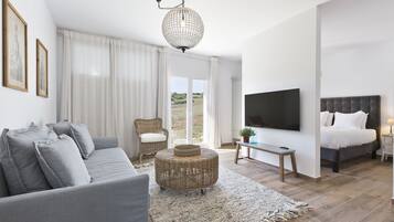 Studio Suite | Living area | 55-inch Smart TV with satellite channels, TV