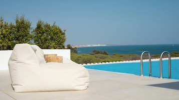 Outdoor pool, open 8:00 AM to 8:00 PM, sun loungers