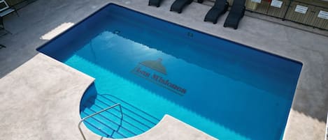 Outdoor pool, open 9:00 AM to 9:00 PM, sun loungers