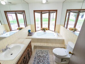 Bathtub, towels, soap, toilet paper