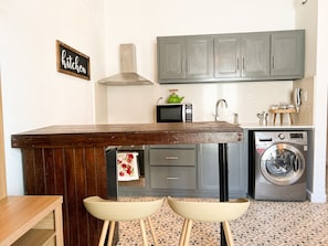 Microwave, oven, coffee/tea maker, cookware/dishes/utensils