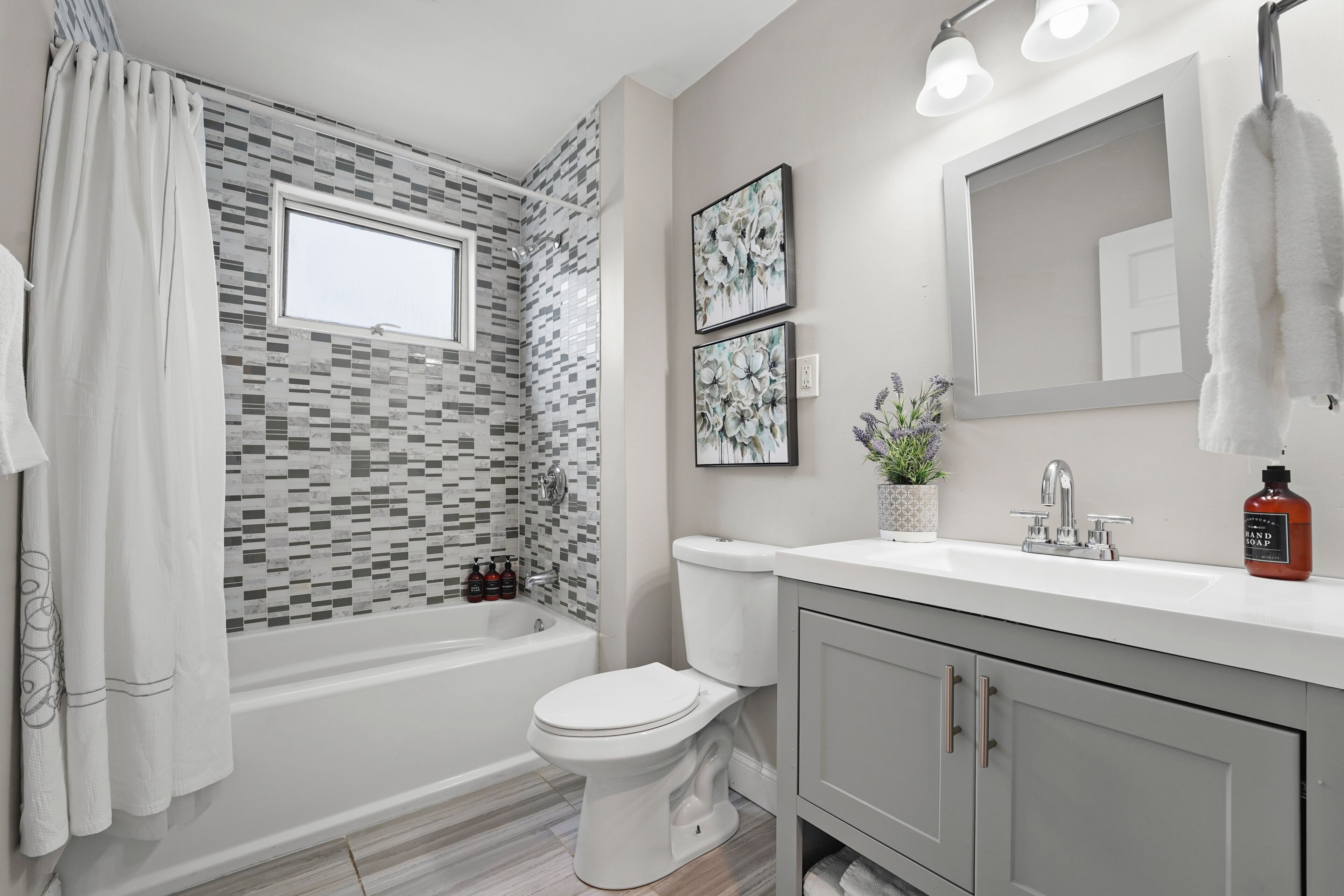 Combined shower/tub, hair dryer, towels, soap