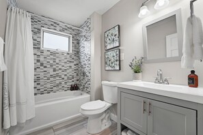 Combined shower/bathtub, hair dryer, towels, soap - 4BR Near Downtown Boston Driveway Parking & 1-Min Walk to Train (Boston)