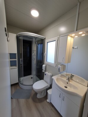 Shower, towels, soap, toilet paper