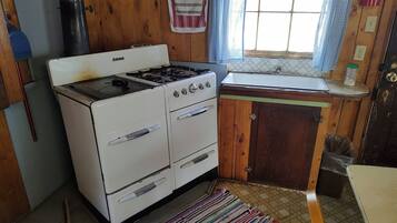 Fridge, coffee/tea maker, toaster, cookware/dishes/utensils
