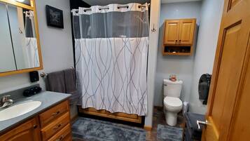 Combined shower/tub, hair dryer, towels, soap