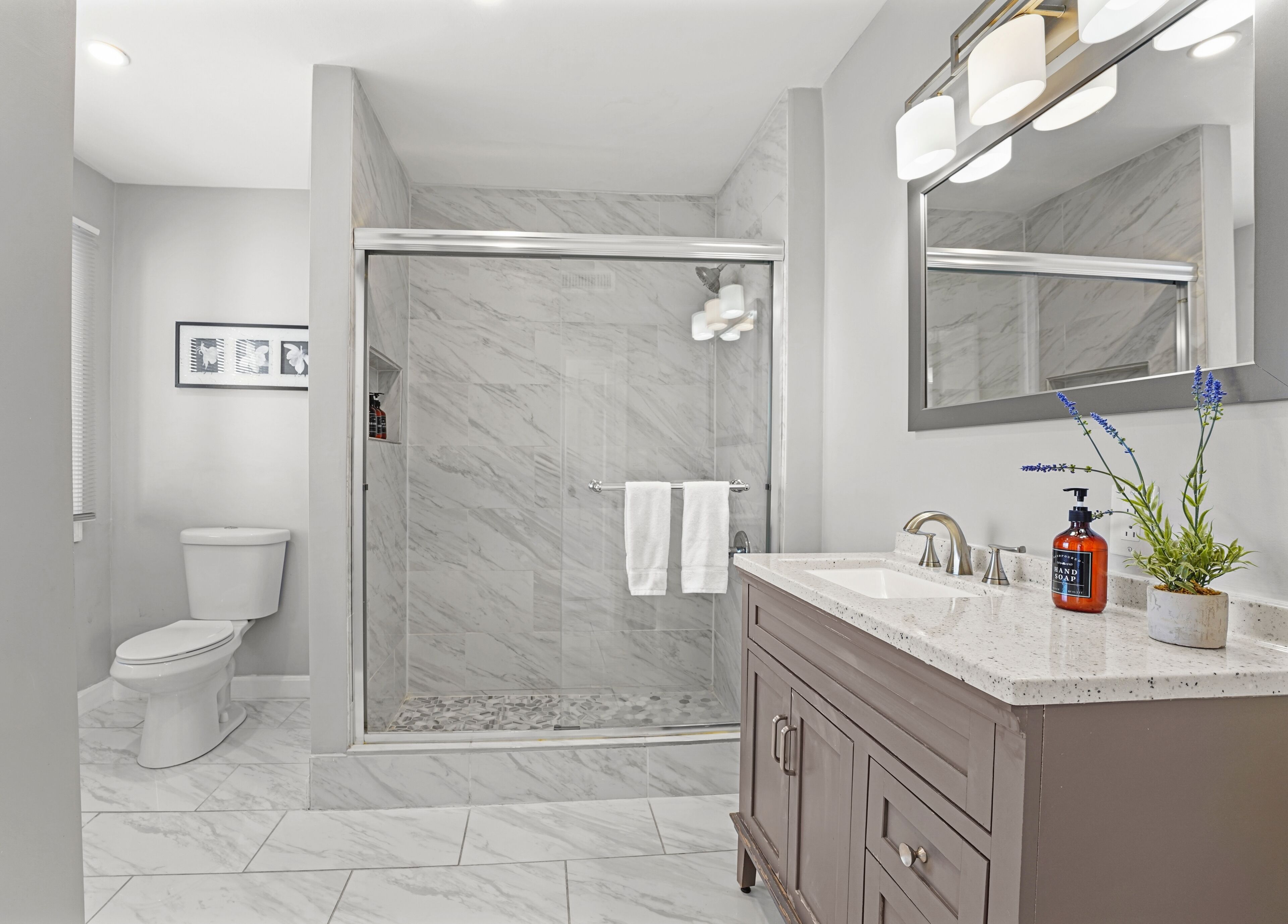 Combined shower/tub, hair dryer, towels, soap