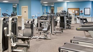 A gym with various exercise machines, a treadmill, and a carpeted floor. - Spa Villa home N Beach resort &spa 2 min to beach 7 pools attractions allow pet (North Myrtle Beach)