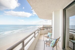 A balcony with a view of the beach and ocean. - Beachview Oasis - NO DRIVE BEACH - Amazing Amenities! CONSTRUCTION IS OVER! (Daytona Beach)