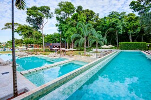 Indoor pool, 4 outdoor pools, open 10:00 AM to 10:00 PM, pool umbrellas
