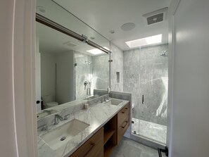 Bathtub, hair dryer, towels, soap