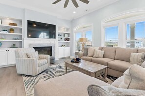 Smart TV, fireplace, table football, books