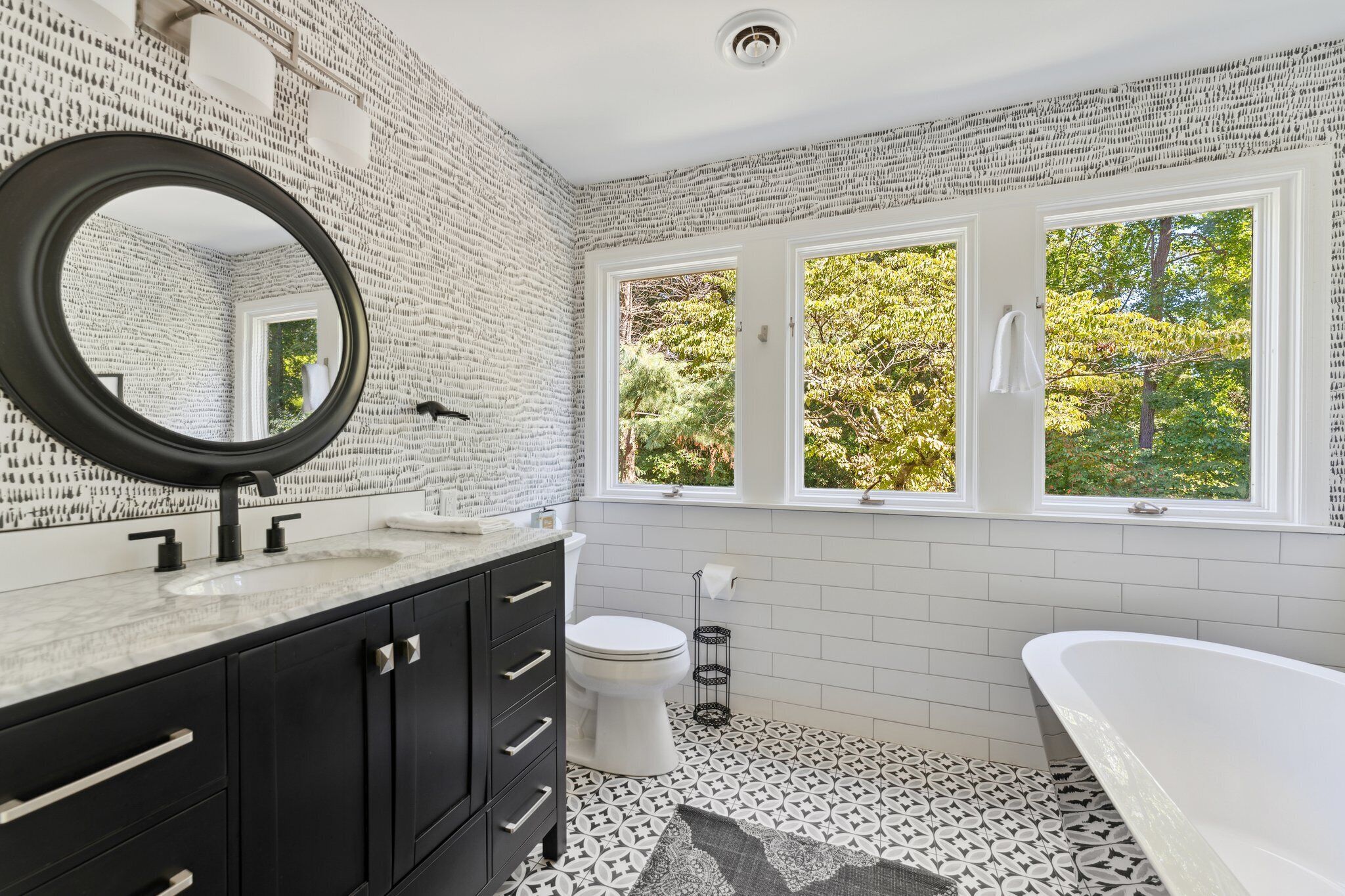 Combined shower/bathtub, towels, toilet paper