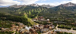 Escape to a mountain town surrounded by dense forests and snow-capped peaks, offering a range of accommodations and a serene lake in the heart of the action.