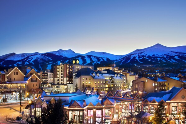Experience the charm of a snow-covered mountain town, surrounded by a variety of architectural styles and lively streets.