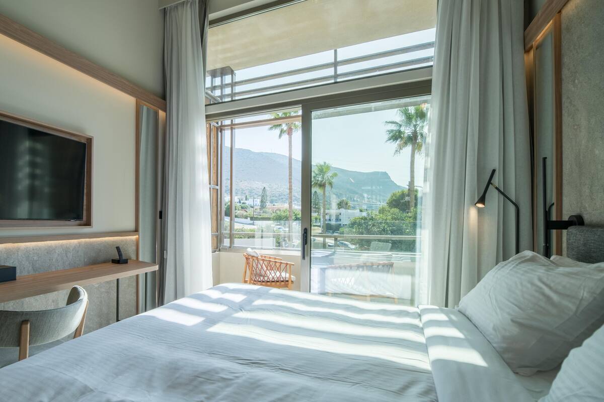 Family Room, Garden View | In-room safe, blackout drapes, soundproofing, iron/ironing board
