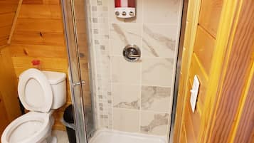 Shower, towels, shampoo, toilet paper