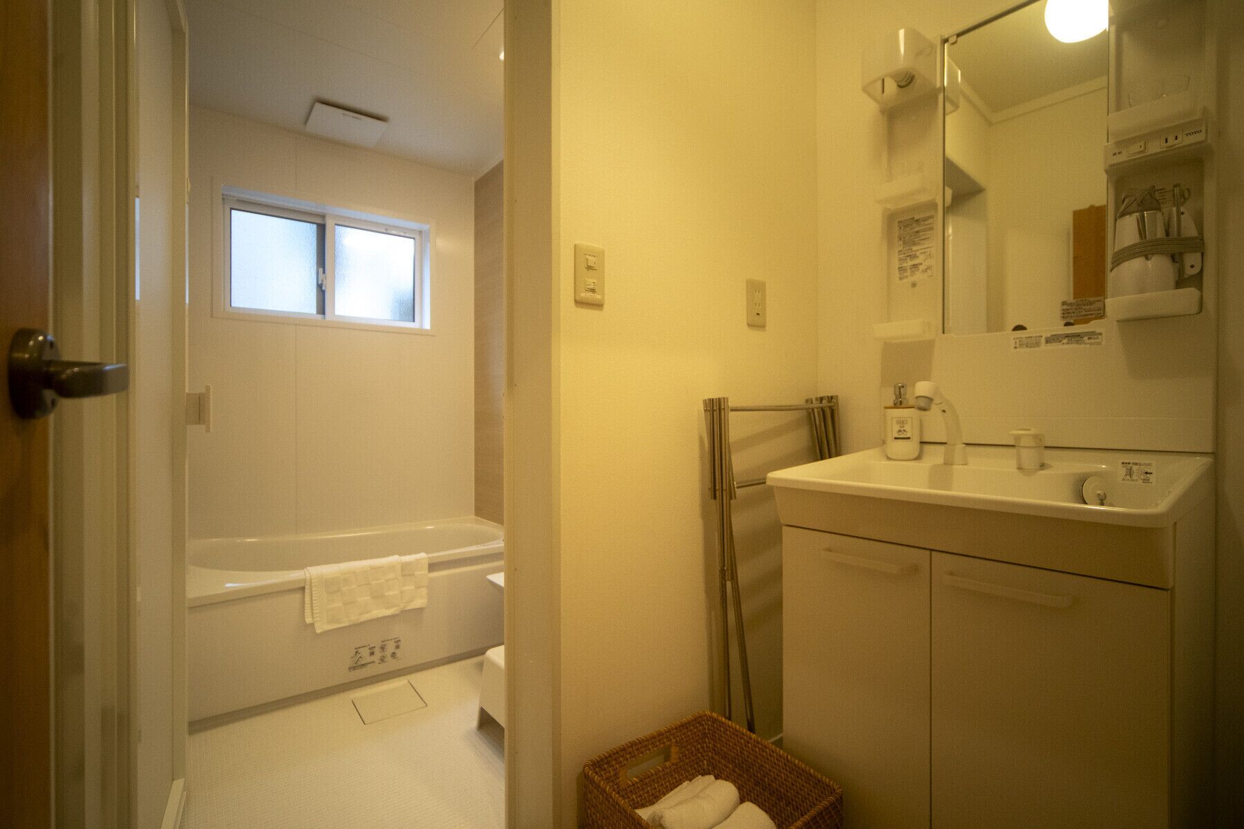 Bathtub, hair dryer, towels, soap