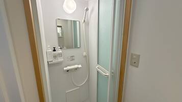 Bathtub, hair dryer, towels, soap