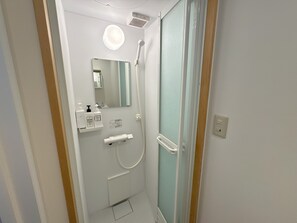 Bathtub, hair dryer, towels, soap