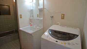 Bathtub, hair dryer, towels, soap