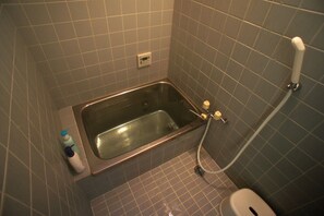 Bathtub, hair dryer, towels, soap