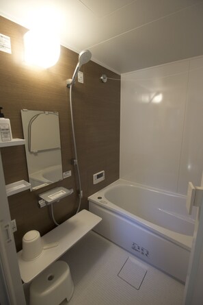 Bathtub, hair dryer, towels, soap