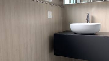 Bathtub, hair dryer, towels, soap