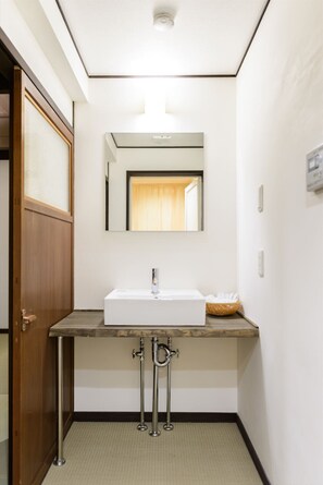 Bathtub, hair dryer, towels, soap