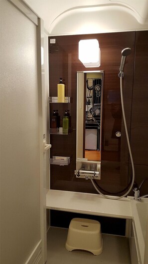 Bathtub, hair dryer, towels, soap