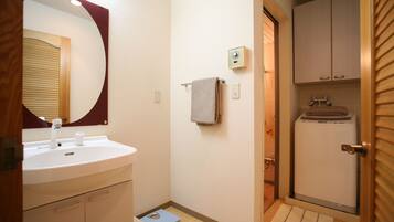 Bathtub, hair dryer, towels, soap