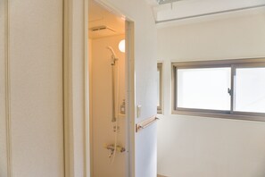 Bathtub, hair dryer, towels, soap