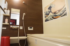 Bathtub, hair dryer, towels, soap