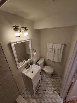 Shower, hair dryer, towels, soap