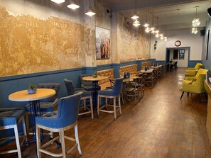 A restaurant interior with booths, tables, and chairs.