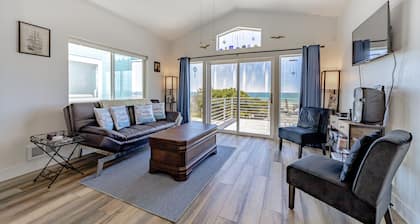 Dog-friendly oceanside home w/WiFi, ocean views, private W/D, deck, & fireplace