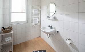 Shower, hair dryer, towels, toilet paper