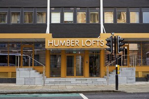 A building with a sign reading "HUMBER LOFTS" at the entrance.