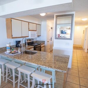 Fridge, microwave, oven, stovetop - Epic Oceanfront Condo, top floor, elevator (Tybee Island)