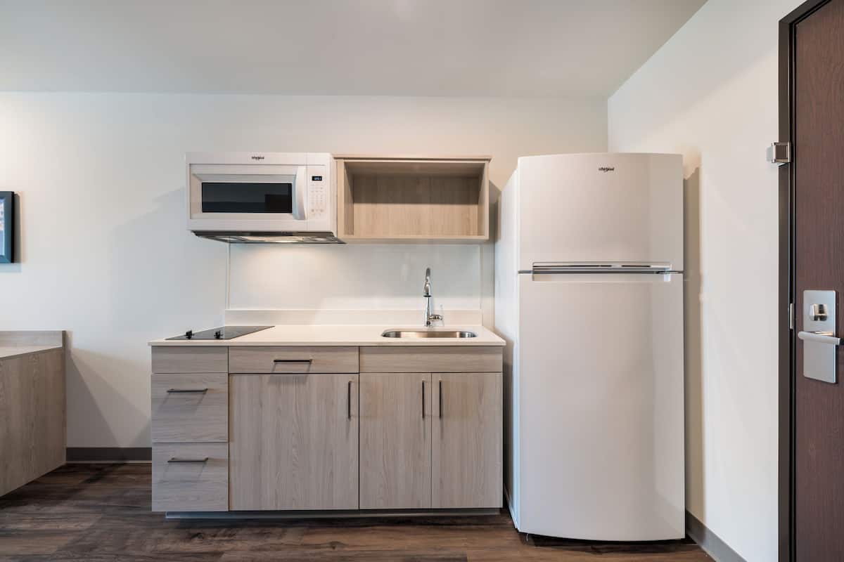 queen suite with sofa | private kitchen