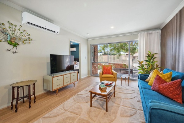 Relax in the comfortable living area with Smart TV for streaming and downtime