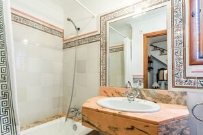 Bathtub, hair dryer, towels