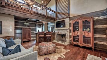 Smart TV, fireplace, books, stereo