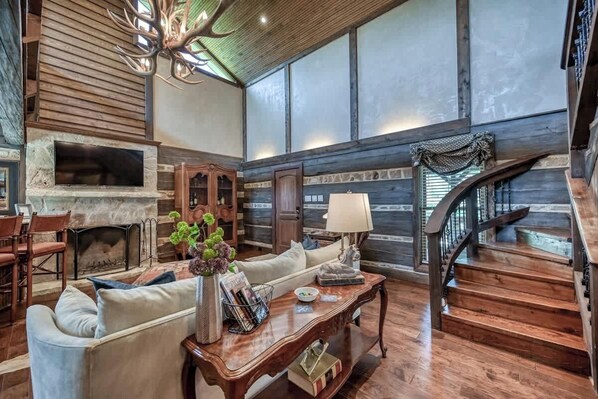 Smart TV, fireplace, books, stereo