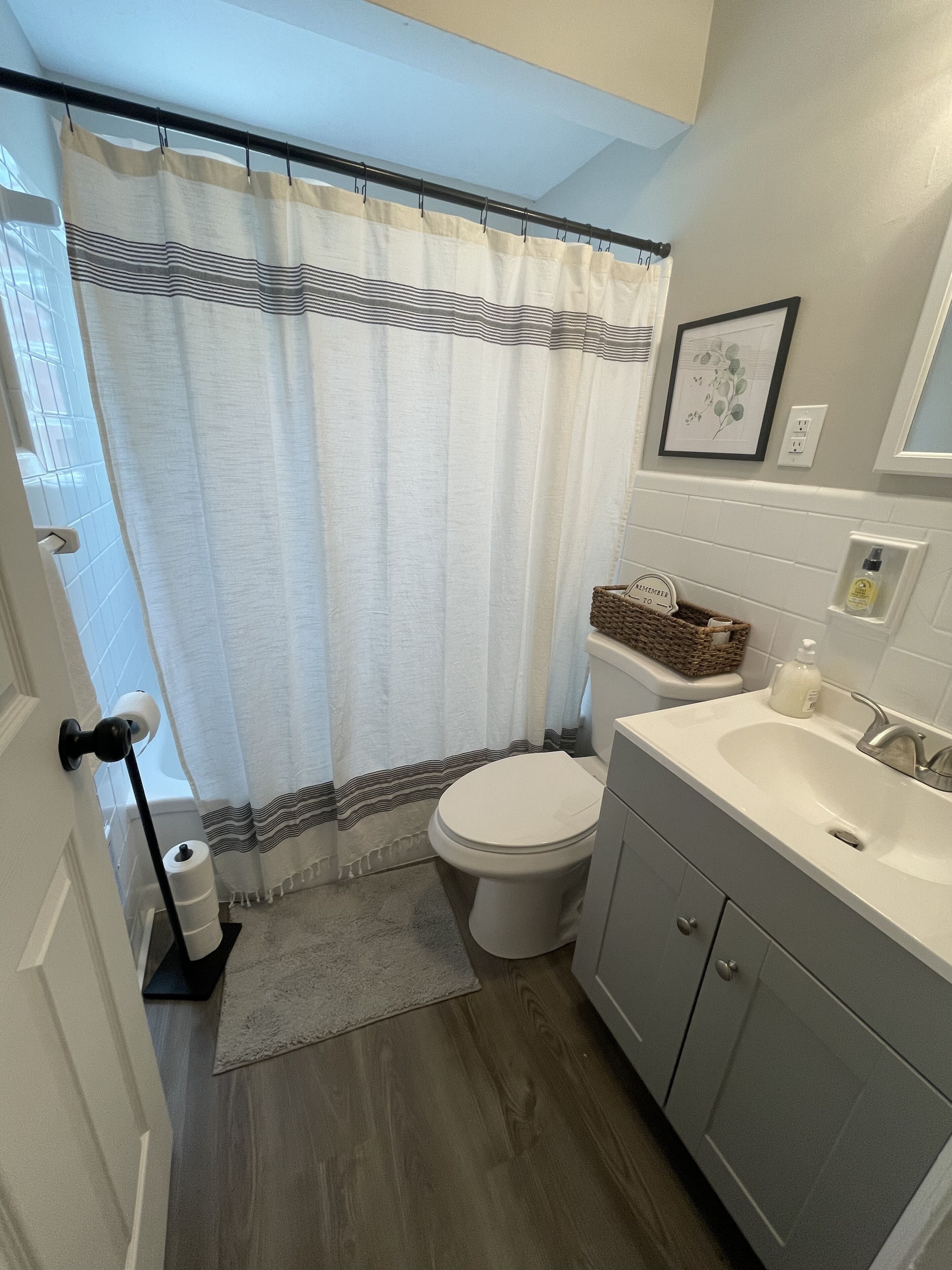 Combined shower/tub, hair dryer, towels, soap